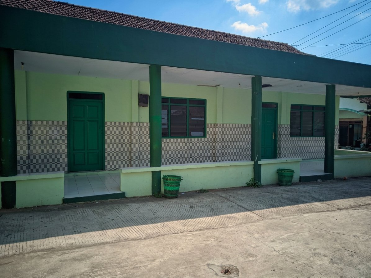 Gedung Madin Sejarah